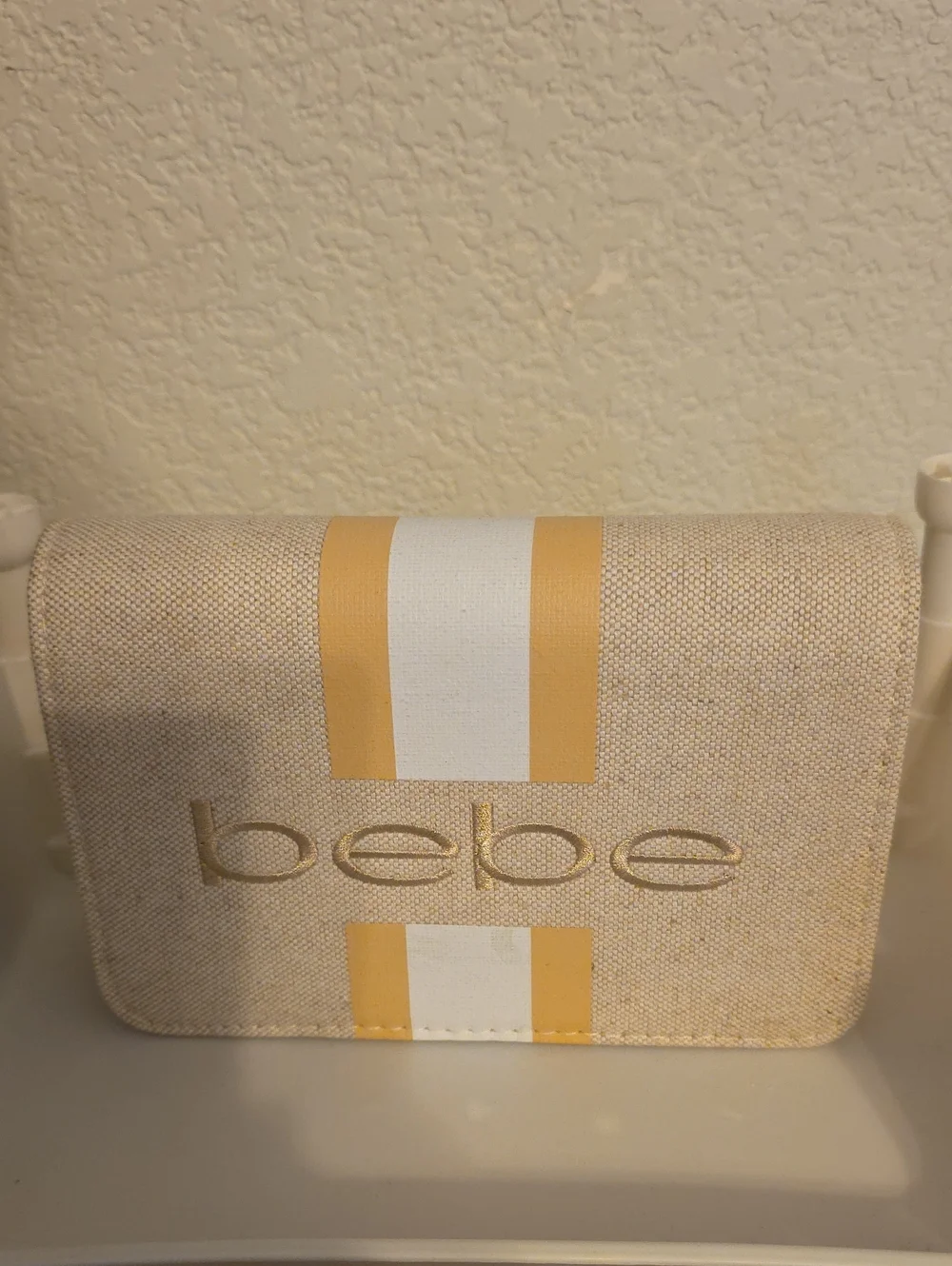 bebe Beige Clutch with Yellow and White Stripes